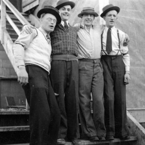 Men at Negus Mine ready to perform music, 1940s. Ed Dusseault, Arnold Smith, unknown, and Frank Nuttall. (Arnold Smith Collection)