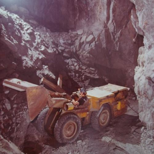 Scooptram dumping ore down a pass at Con Mine, 1977. (Con Mine Collection)